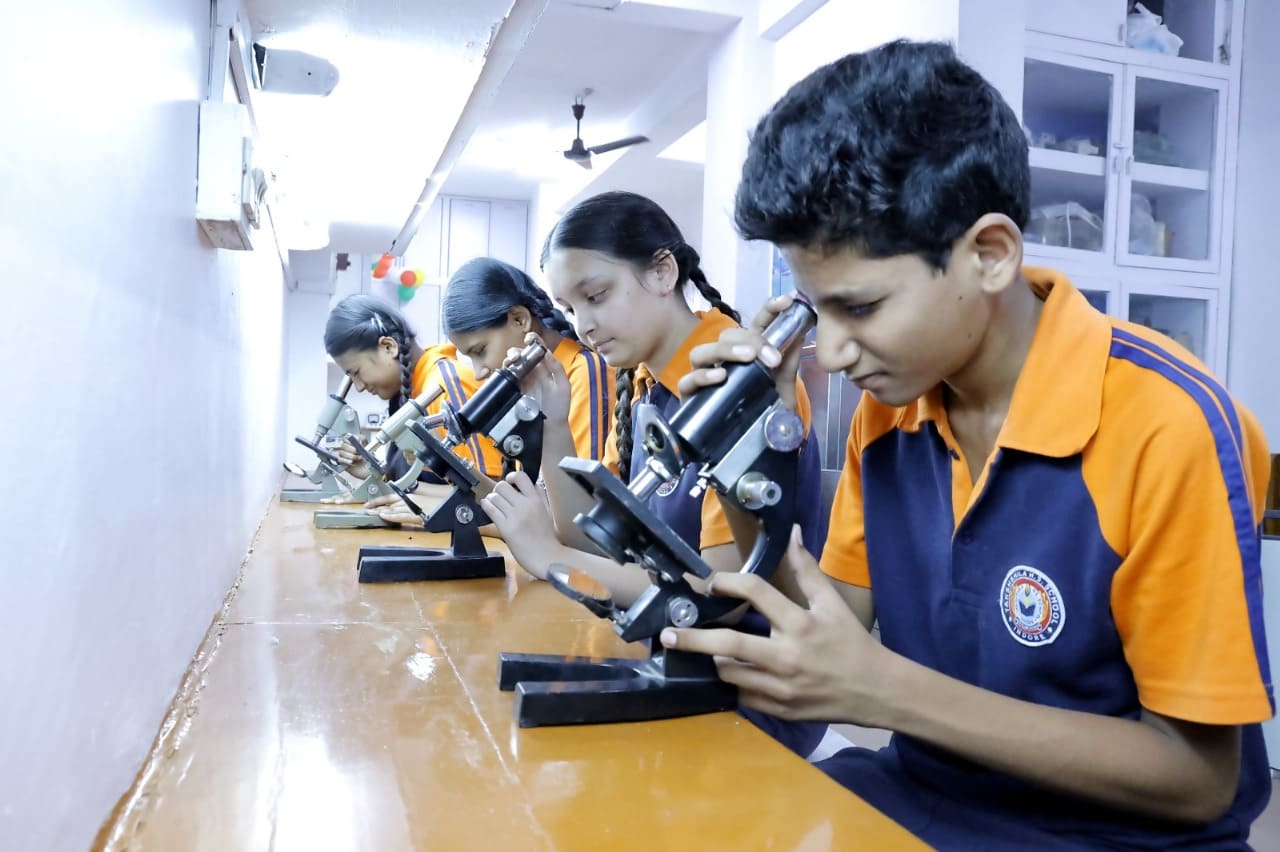 Students using microscopes in the Biology Lab
