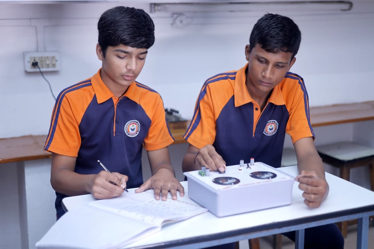 Students performing a Physics Lab experiment